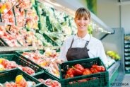 Verkäuferin im Supermarkt zeigt frisches Gemüse - Buy this stock photo and  explore similar images at Adobe Stock | Adobe Stock