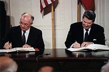https://upload.wikimedia.org/wikipedia/commons/thumb/8/8d/Reagan_and_Gorbachev_signing.jpg/220px-Reagan_and_Gorbachev_signing.jpg