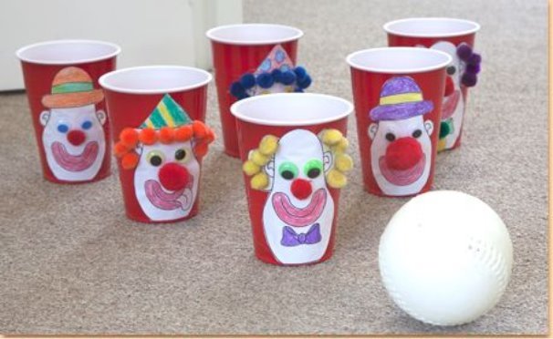 Use plastic cups to create a fun circus bowling game for preschoolers or younger elementary students. Download the free printable for kids to color! | craftprojectideas.com