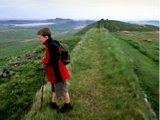 Photo of a boy standing atop Hadrian's Wall