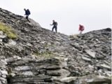 Photo: Hikers walking above abandoned quarry