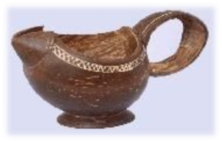 A unique and delightful work of art, this tea kettle has been made from coconut shells. Sure to attract alluring glances and appreciation, this kettle is a testimony to the distinguished skill of the artist. Smooth contours and a wide handle make it easy to use while lending it an elegance stemming from simplicity.