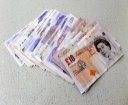 British-pound-notes-on-table.jpg
