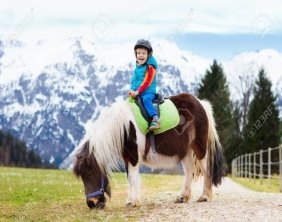 D:\100107346-kids-riding-pony-in-the-alps-mountains-family-spring-vacation-on-horse-ranch-in-austria-tirol-childr.jpg